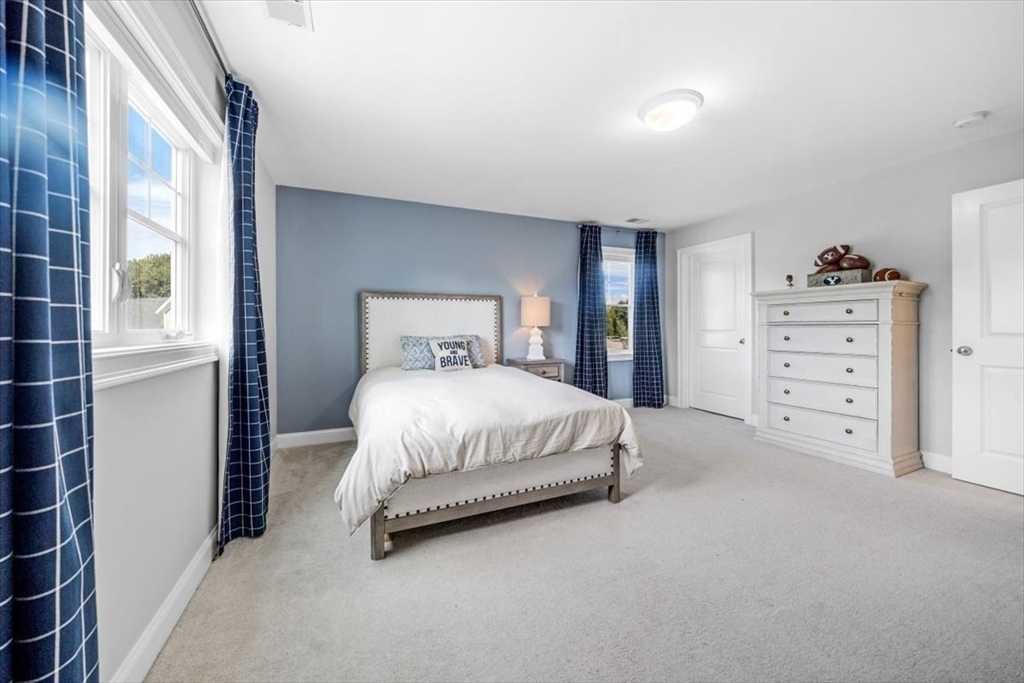14 Longwood Lane, Unit 14 Hanover, MA 02339 - Photo 25 of 42 a bedroom with a bed and a window