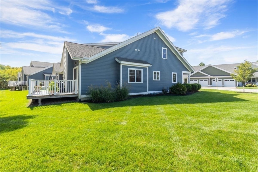 14 Longwood Lane, Unit 14 Hanover, MA 02339 - Photo 33 of 42 a front view of house with yard and lake view