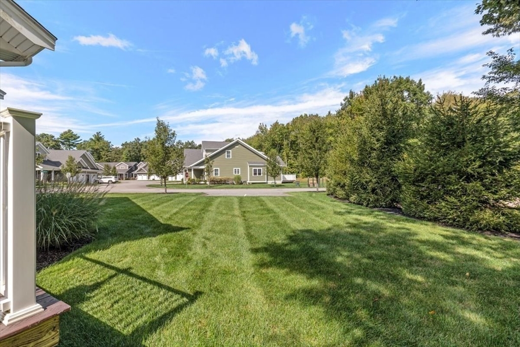 14 Longwood Lane, Unit 14 Hanover, MA 02339 - Photo 37 of 42 a view of yard with swimming pool and green space