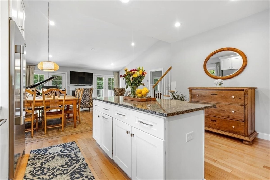 14 Longwood Lane, Unit 14 Hanover, MA 02339 - Photo 4 of 42 a kitchen with stainless steel appliances granite countertop a stove and a wooden floors