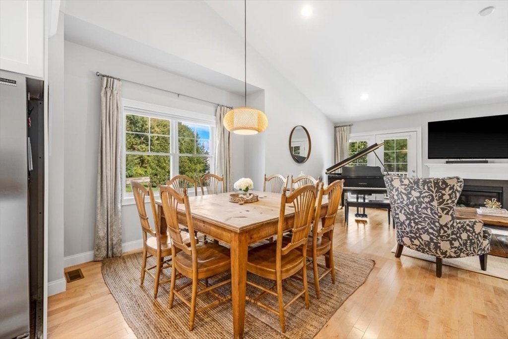 14 Longwood Lane, Unit 14 Hanover, MA 02339 - Photo 6 of 42 a view of a dining room with furniture and wooden floor