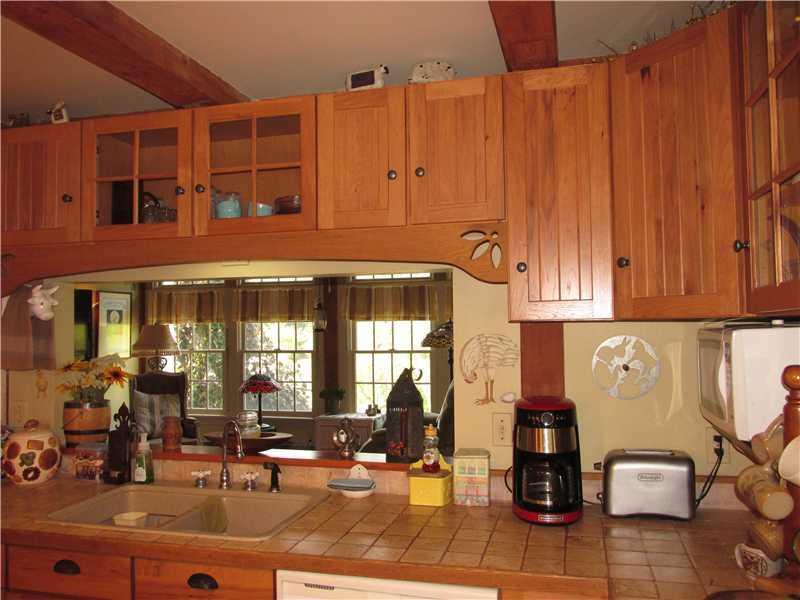 6 Twombly Road Monroe, ME 04951 - Photo 14 of 35 Kitchen. Tile counter tops and open...