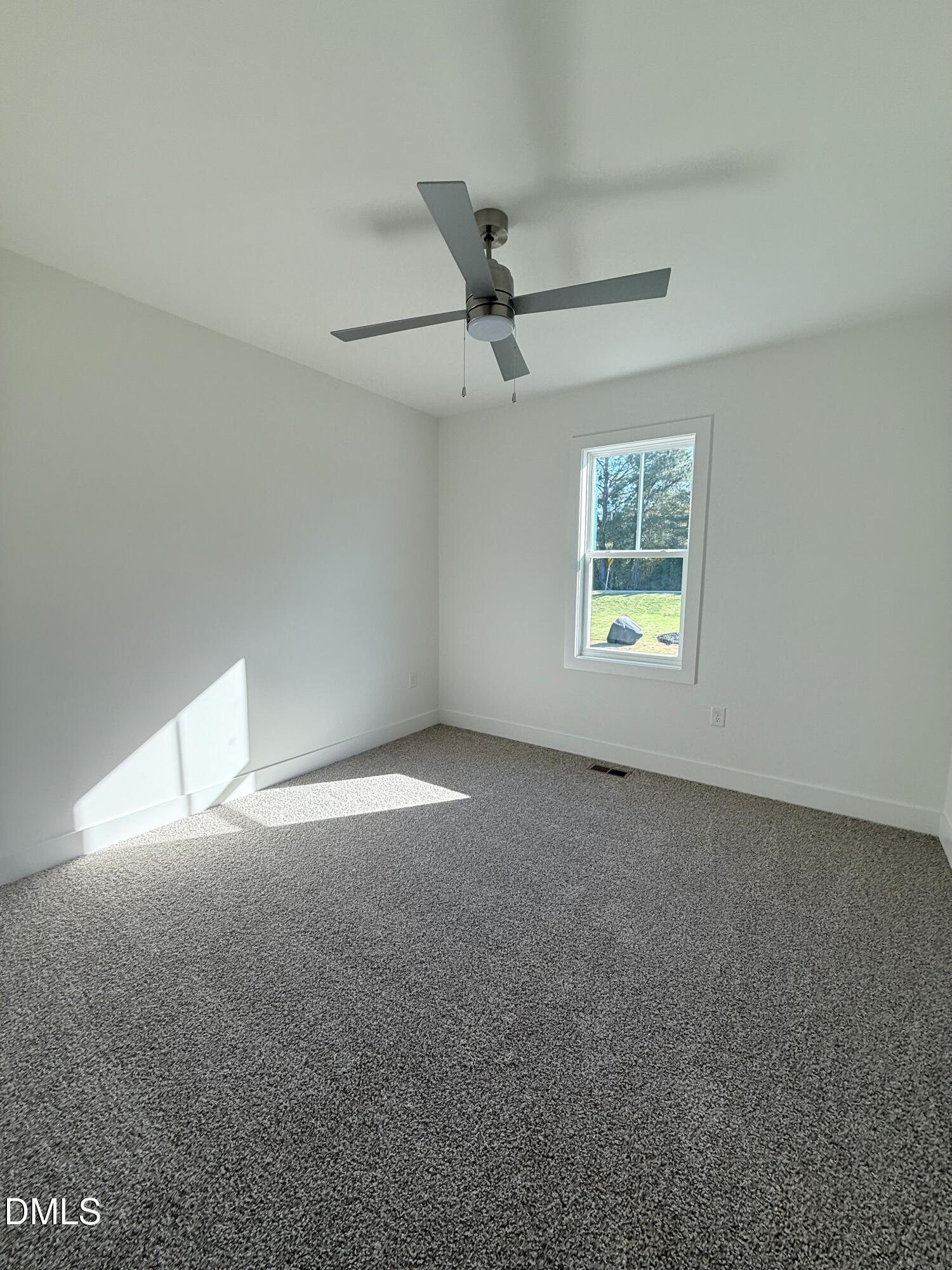 6906 Fire Tower Road Spring Hope, NC 27882 - Photo 12 of 32 a view of an empty room with a window