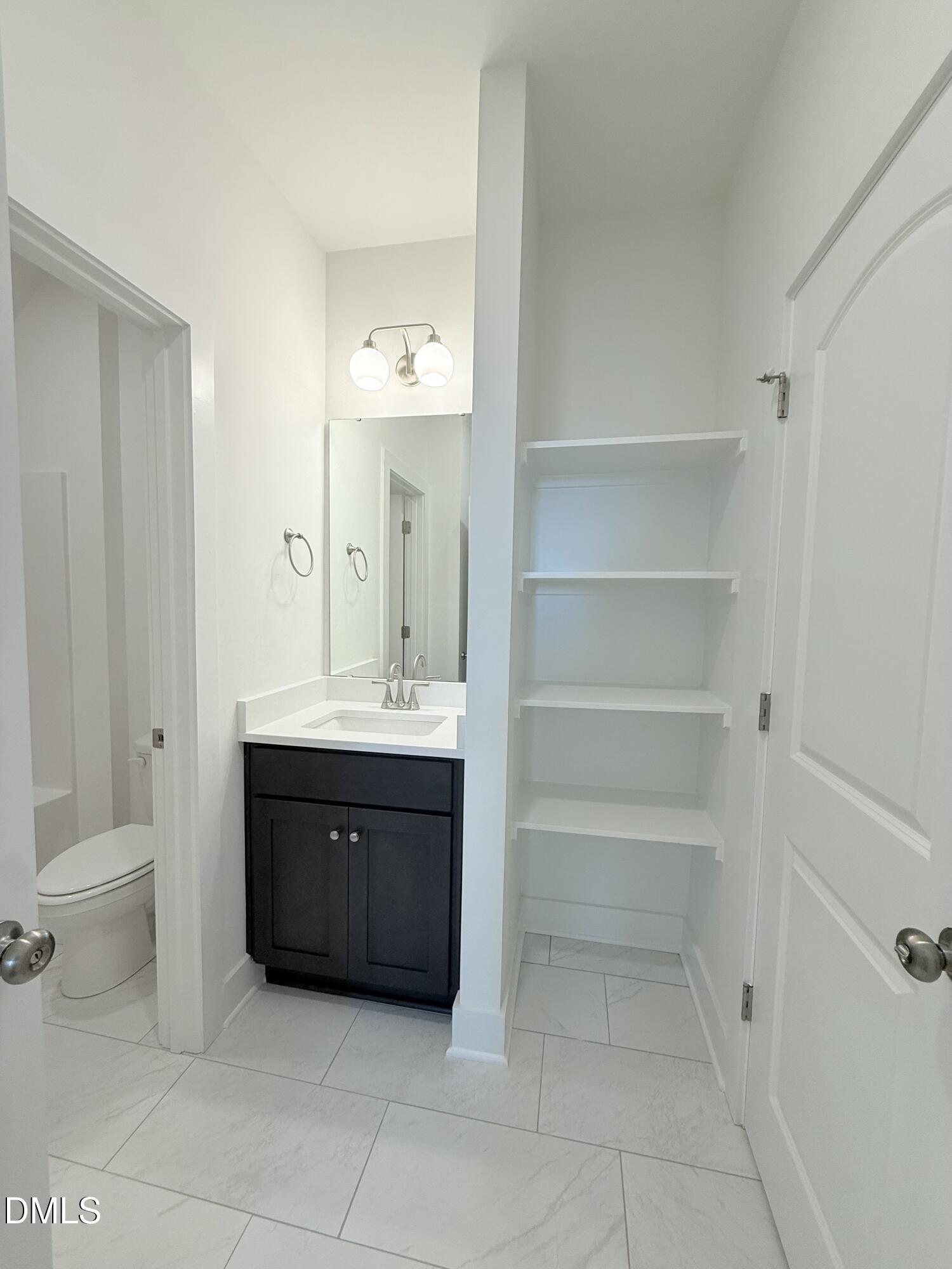 6906 Fire Tower Road Spring Hope, NC 27882 - Photo 23 of 32 a bathroom with a bathtub sink vanity and toilet