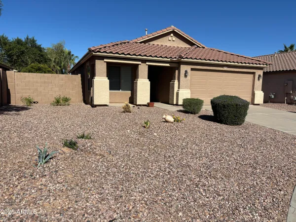 a front view of a house with a garage