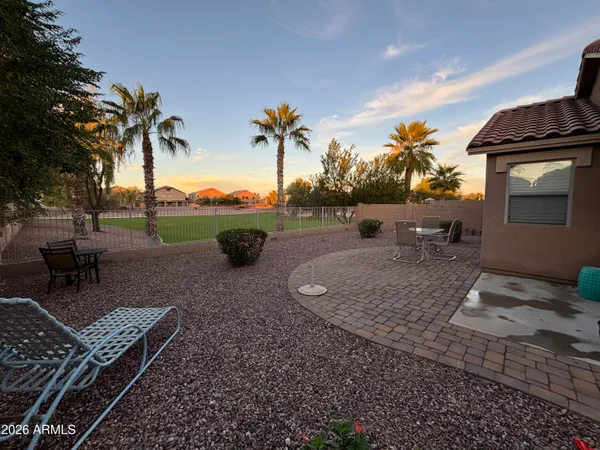 a view of a backyard with sitting area