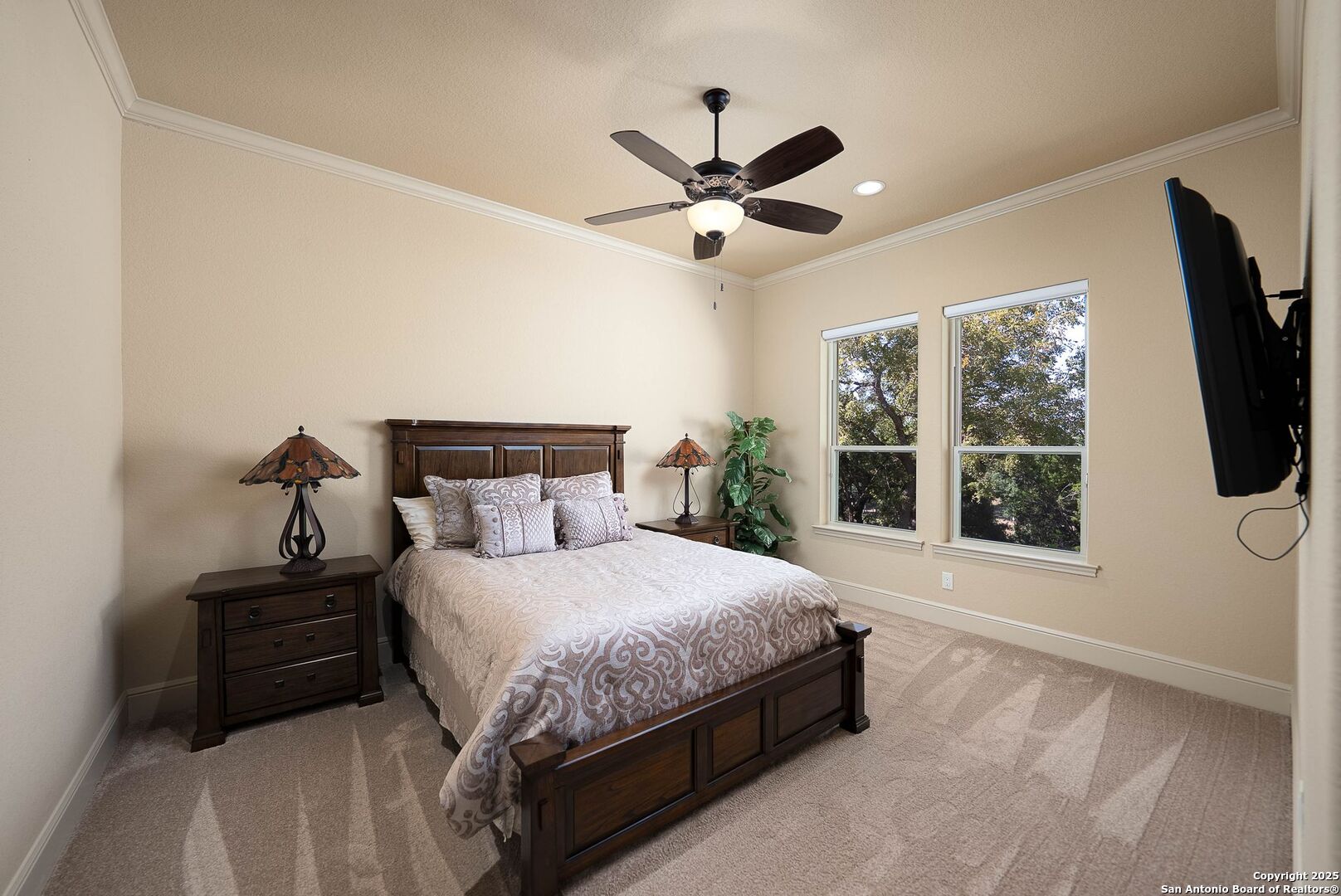 631 Menger Springs Boerne, TX 78006 - Photo 15 of 54 a bedroom with a large bed and a large window