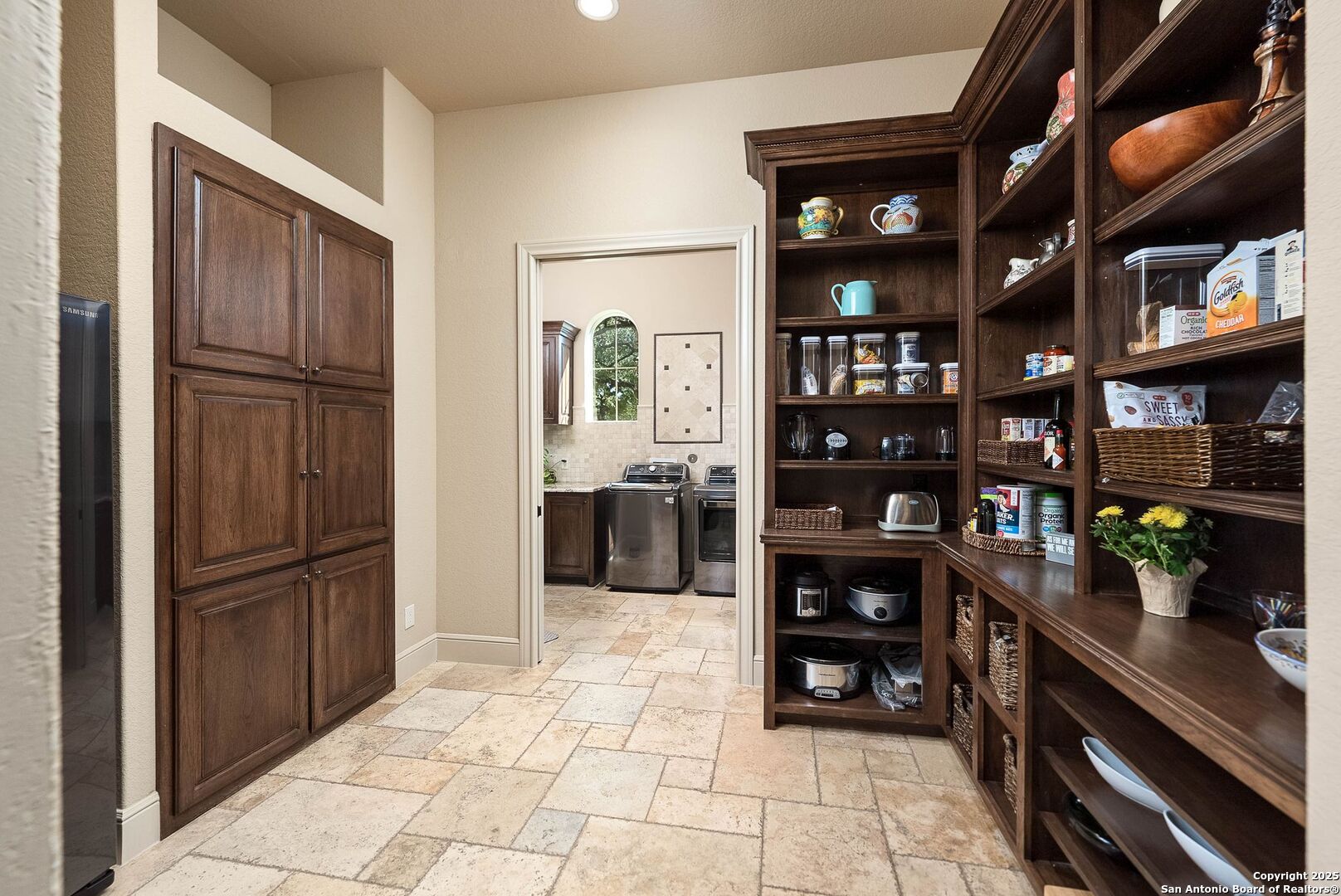 631 Menger Springs Boerne, TX 78006 - Photo 19 of 54 a kitchen with stainless steel appliances a refrigerator and cabinets