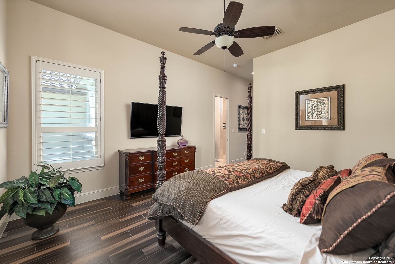 631 Menger Springs Boerne, TX 78006 - Photo 23 of 54 a bedroom with a bed and a flat screen tv