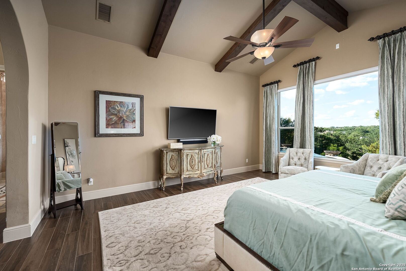 631 Menger Springs Boerne, TX 78006 - Photo 27 of 54 a bedroom with a bed and a flat screen tv
