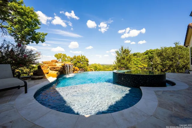 a view of an outdoor space pool patio and outdoor seating