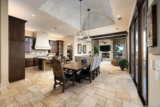 a living room with fireplace furniture and a flat screen tv