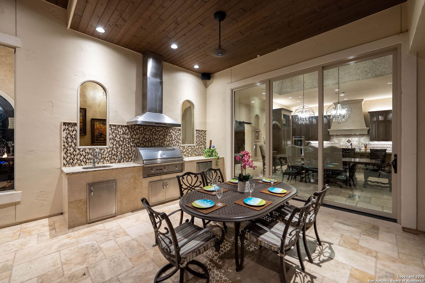 631 Menger Springs Boerne, TX 78006 - Photo 51 of 54 a kitchen with a dining table chairs stainless steel appliances and cabinets