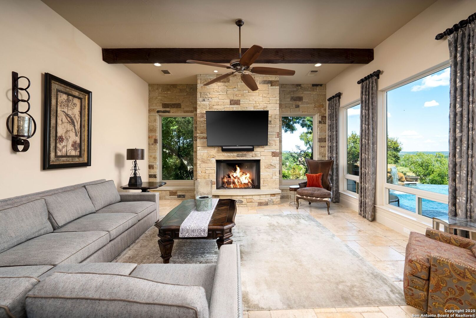 631 Menger Springs Boerne, TX 78006 - Photo 6 of 54 a living room with furniture a flat screen tv and a fireplace