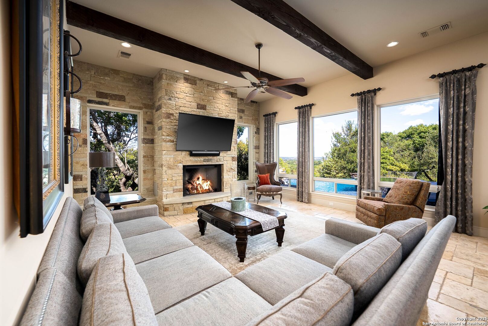 631 Menger Springs Boerne, TX 78006 - Photo 7 of 54 a living room with fireplace furniture and a flat screen tv