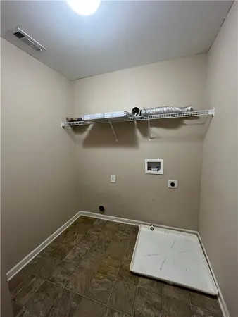 an empty room with a wooden floor