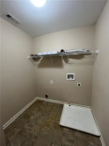 an empty room with a wooden floor