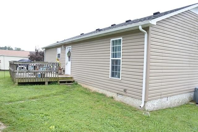 178 Thomas Road Livingston, TN 38570 - Photo 3 of 20 a view of a house with a yard and deck
