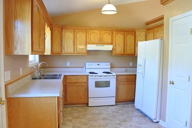 178 Thomas Road Livingston, TN 38570 - Photo 10 of 20 a kitchen with a stove a refrigerator and a sink
