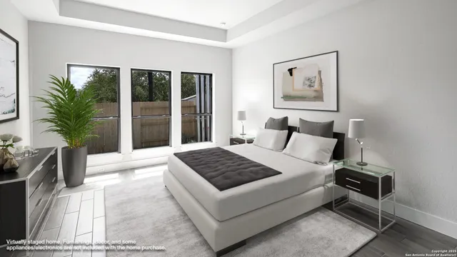 a bedroom with a large bed and a window