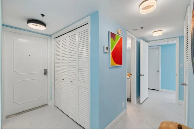 a kitchen with stainless steel appliances a stove a sink and a microwave