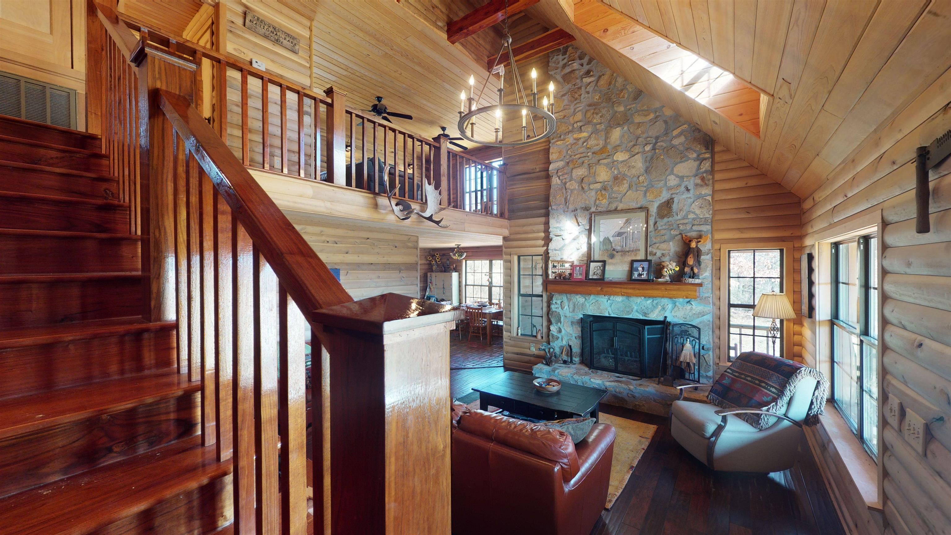 632 Mayflower Road Ramer, TN 38367 - Photo 12 of 25 a living room with furniture a fireplace and a large window
