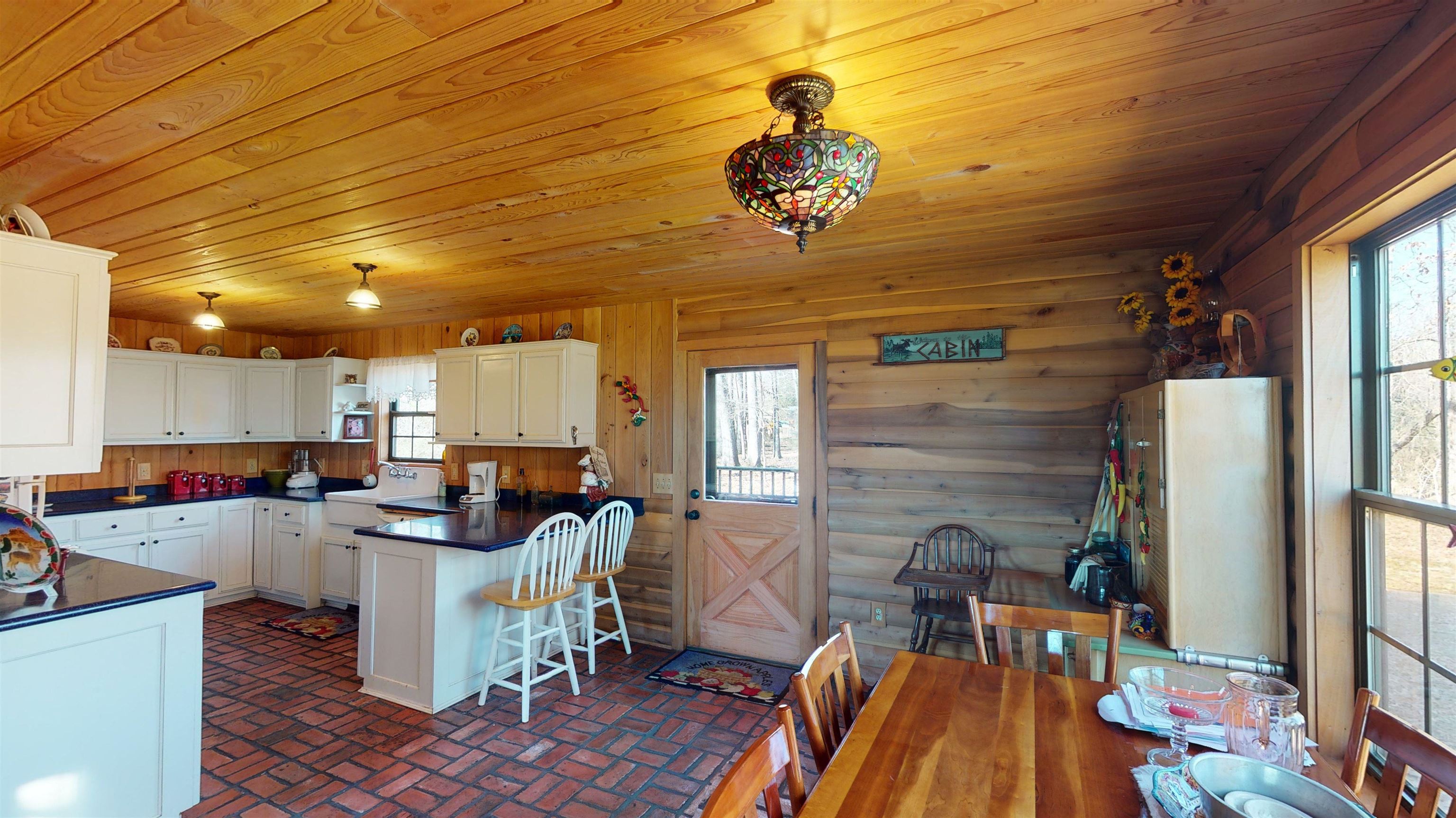 632 Mayflower Road Ramer, TN 38367 - Photo 5 of 25 a view of a dining room with furniture a chandelier and wooden floor