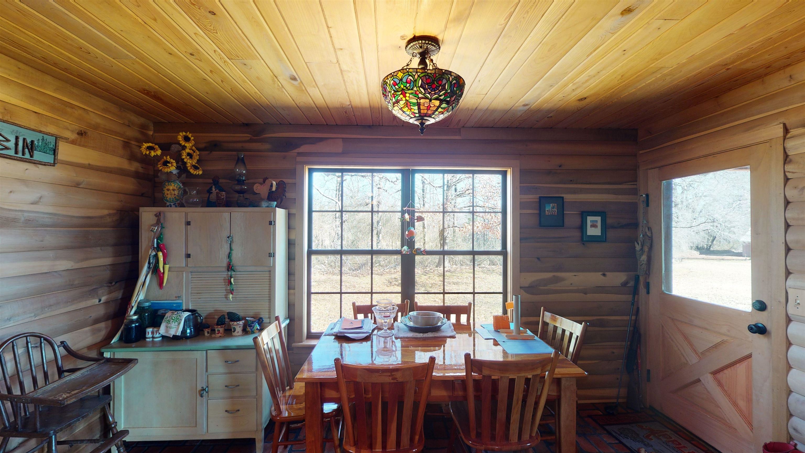 632 Mayflower Road Ramer, TN 38367 - Photo 6 of 25 a view of a dining room with furniture window and outside view
