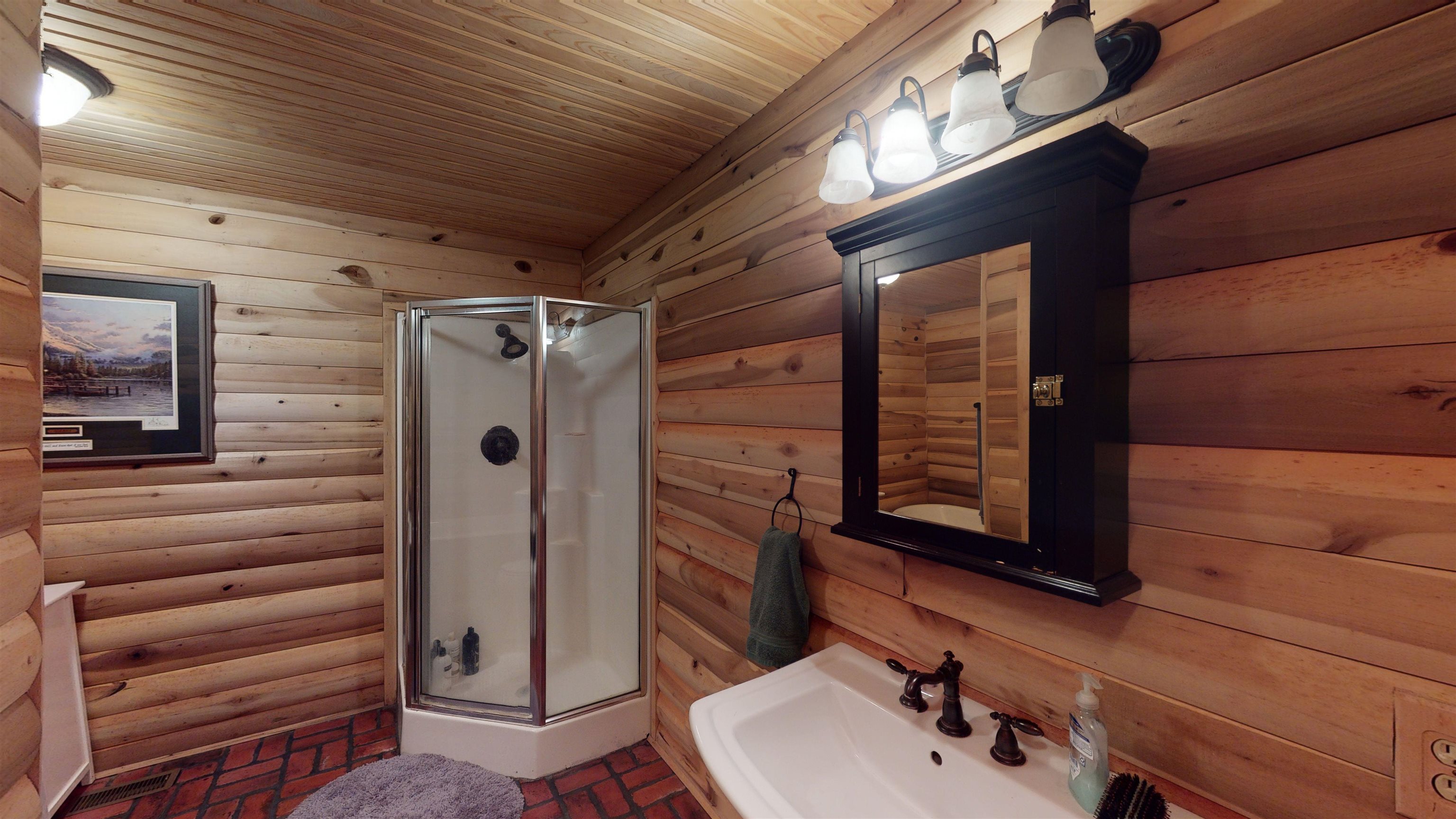632 Mayflower Road Ramer, TN 38367 - Photo 10 of 25 a bathroom with a sink and a mirror
