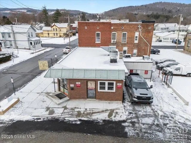 a kitchen with stainless steel appliances granite countertop a sink and a refrigerator