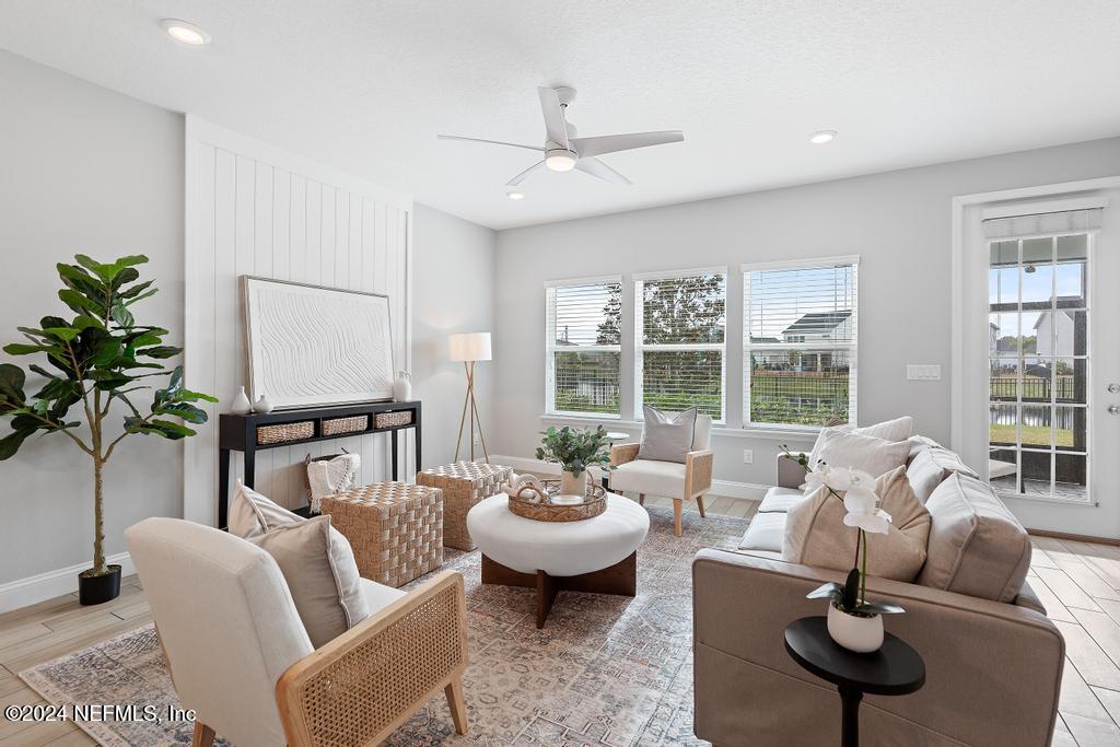 185 Clifton Bay Loop St. Johns, FL 32259 - Photo 11 of 92 a living room with furniture and a large window