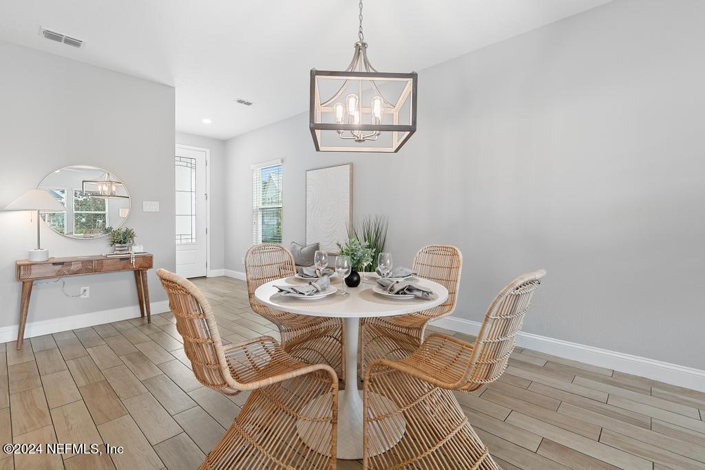 185 Clifton Bay Loop St. Johns, FL 32259 - Photo 18 of 92 a view of a dining room with furniture and a table