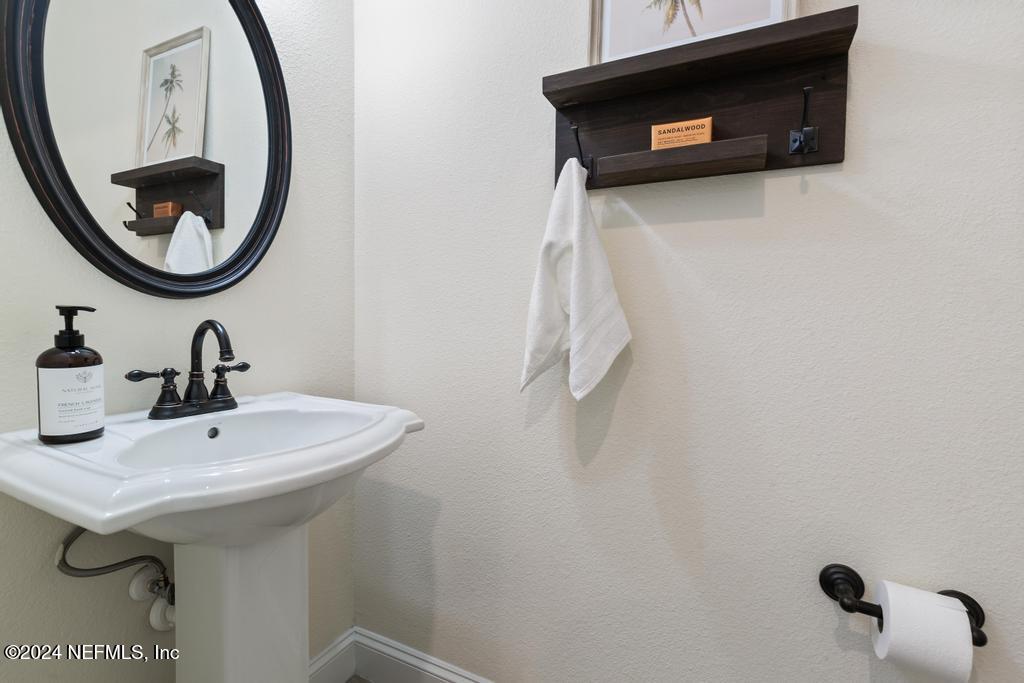 185 Clifton Bay Loop St. Johns, FL 32259 - Photo 20 of 92 a bathroom with a sink and a mirror