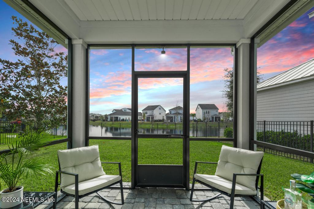 185 Clifton Bay Loop St. Johns, FL 32259 - Photo 2 of 92 a balcony with furniture and a yard
