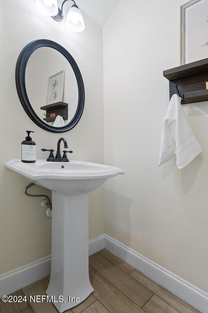 185 Clifton Bay Loop St. Johns, FL 32259 - Photo 21 of 92 a bathroom with a sink and a mirror