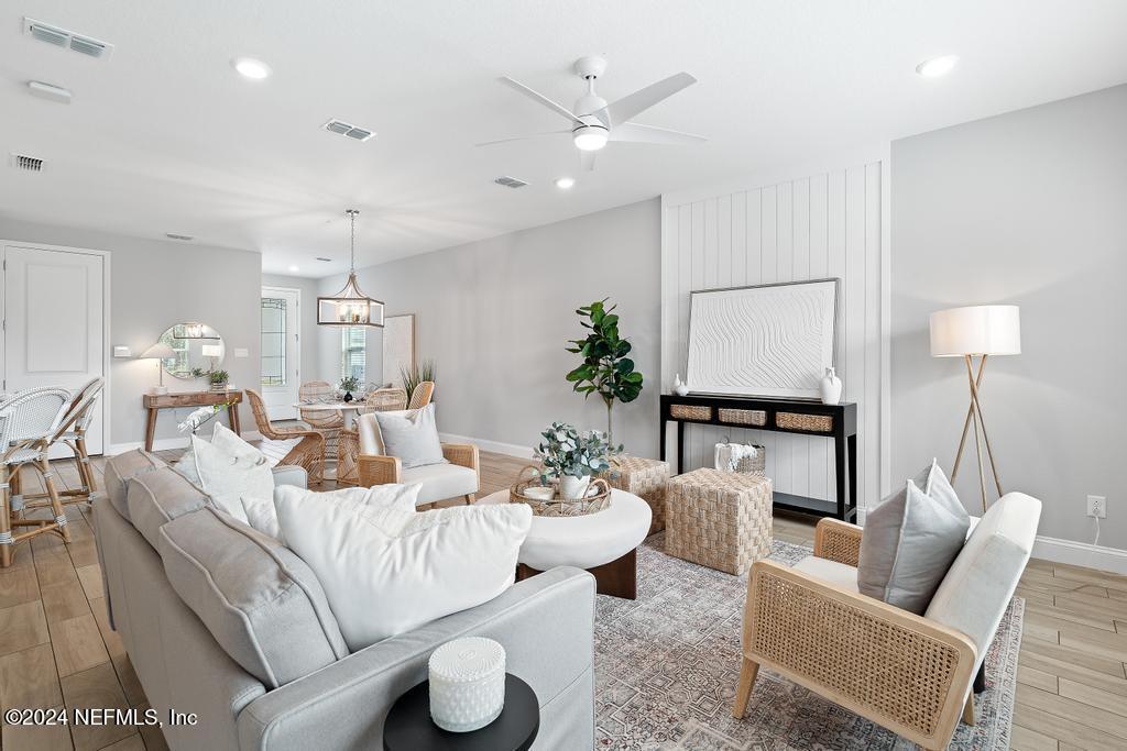 185 Clifton Bay Loop St. Johns, FL 32259 - Photo 25 of 92 a living room with furniture and a lamp