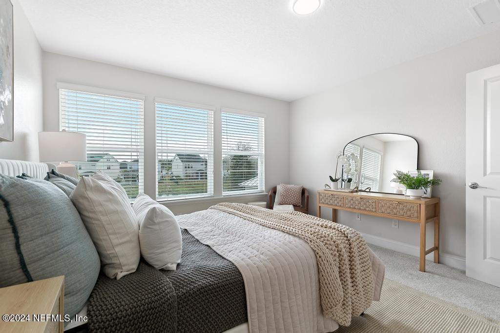 185 Clifton Bay Loop St. Johns, FL 32259 - Photo 33 of 92 a bedroom with a bed and a large window