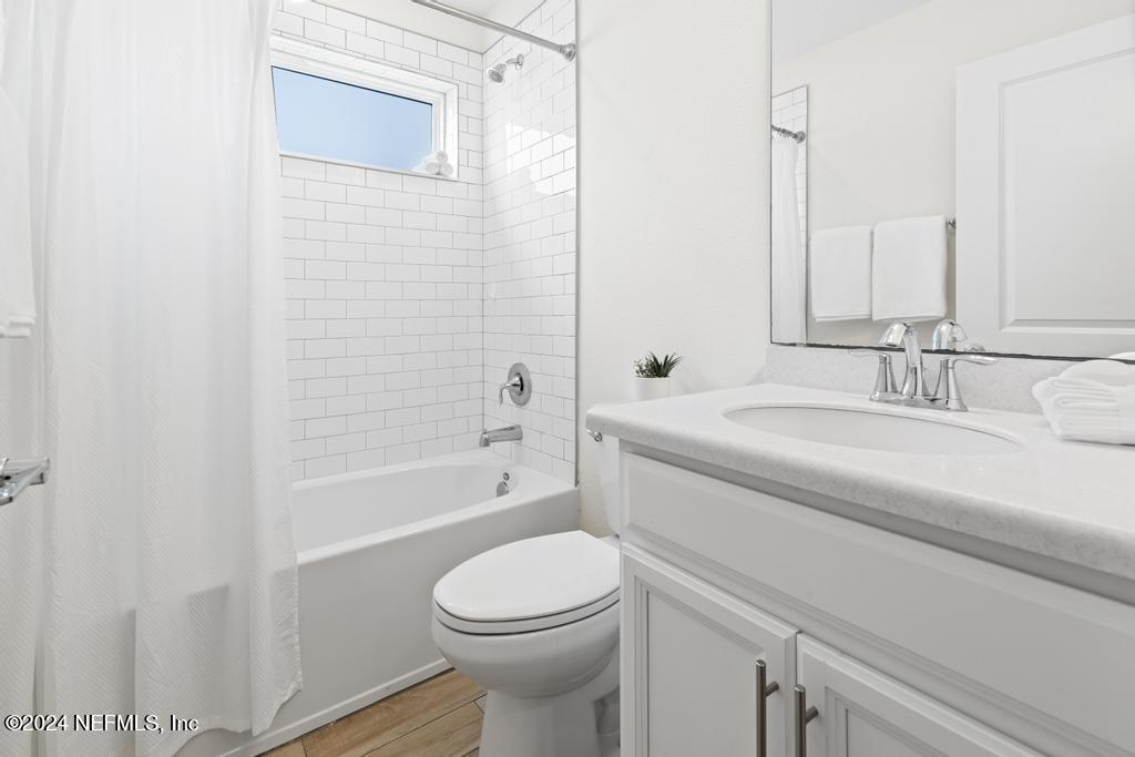 185 Clifton Bay Loop St. Johns, FL 32259 - Photo 42 of 92 a bathroom with a sink a toilet and a bathtub
