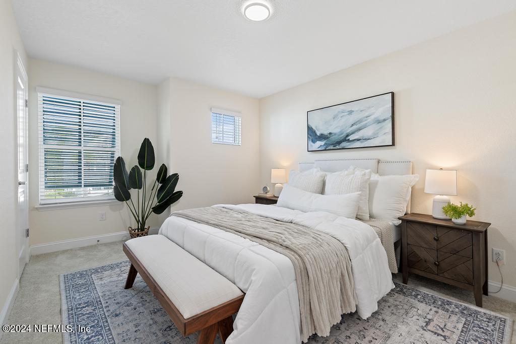 185 Clifton Bay Loop St. Johns, FL 32259 - Photo 43 of 92 a bedroom with a bed and a window