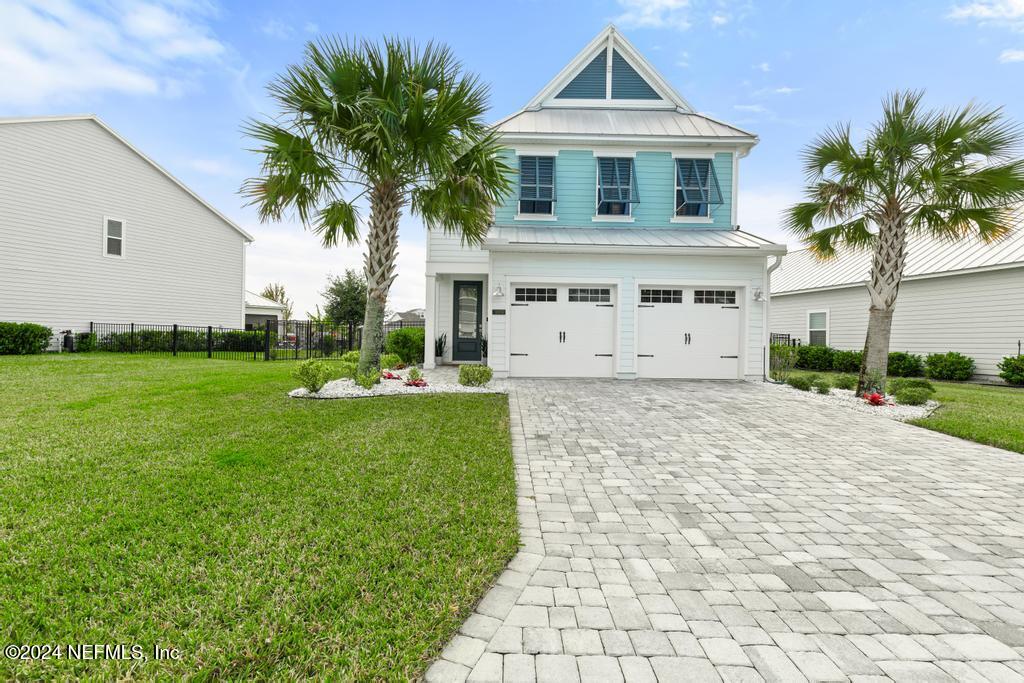 185 Clifton Bay Loop St. Johns, FL 32259 - Photo 64 of 92 a front view of a house with a garden
