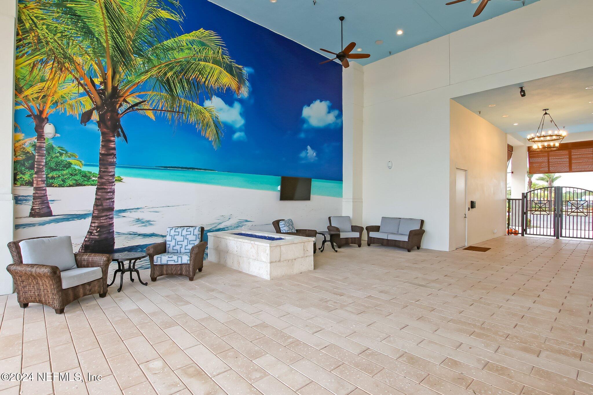 185 Clifton Bay Loop St. Johns, FL 32259 - Photo 78 of 92 a view of a patio with dining table and chairs under an umbrella