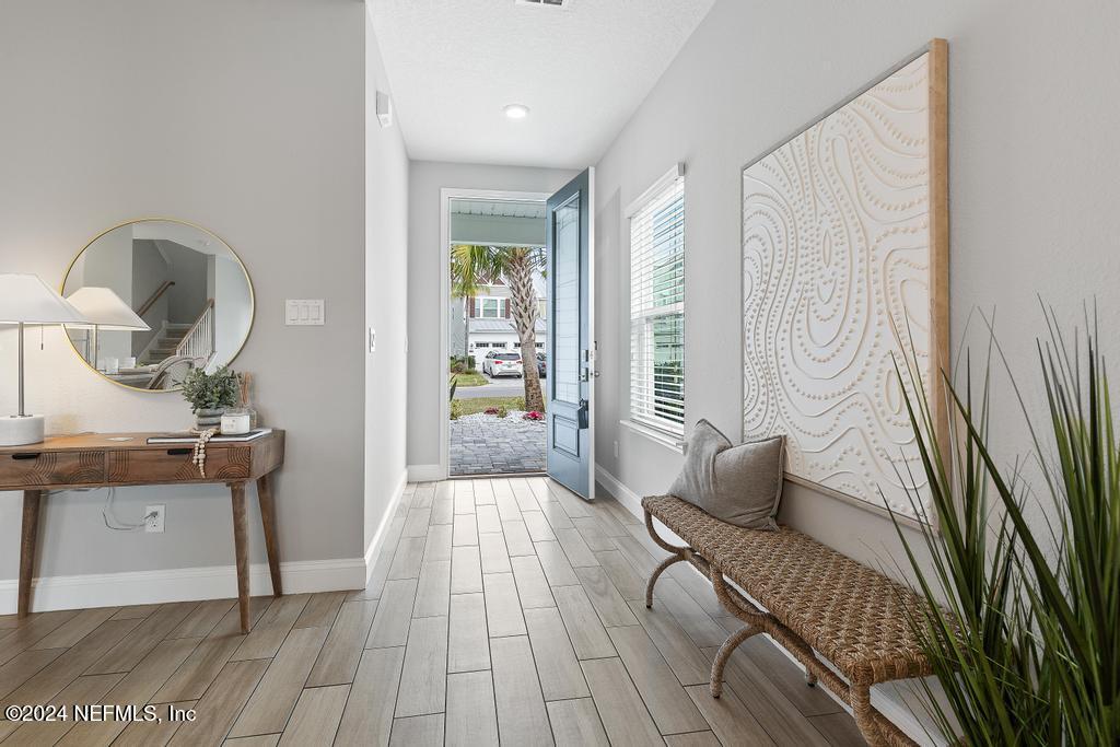 185 Clifton Bay Loop St. Johns, FL 32259 - Photo 8 of 92 a living room with furniture and a wooden floor