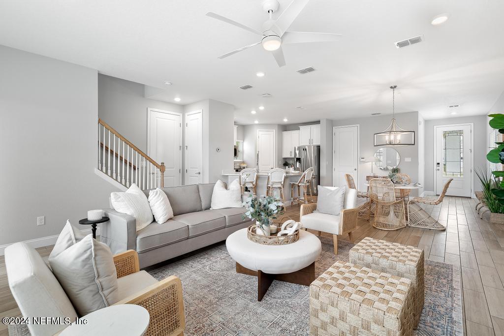 185 Clifton Bay Loop St. Johns, FL 32259 - Photo 10 of 92 a living room with furniture and a wooden floor