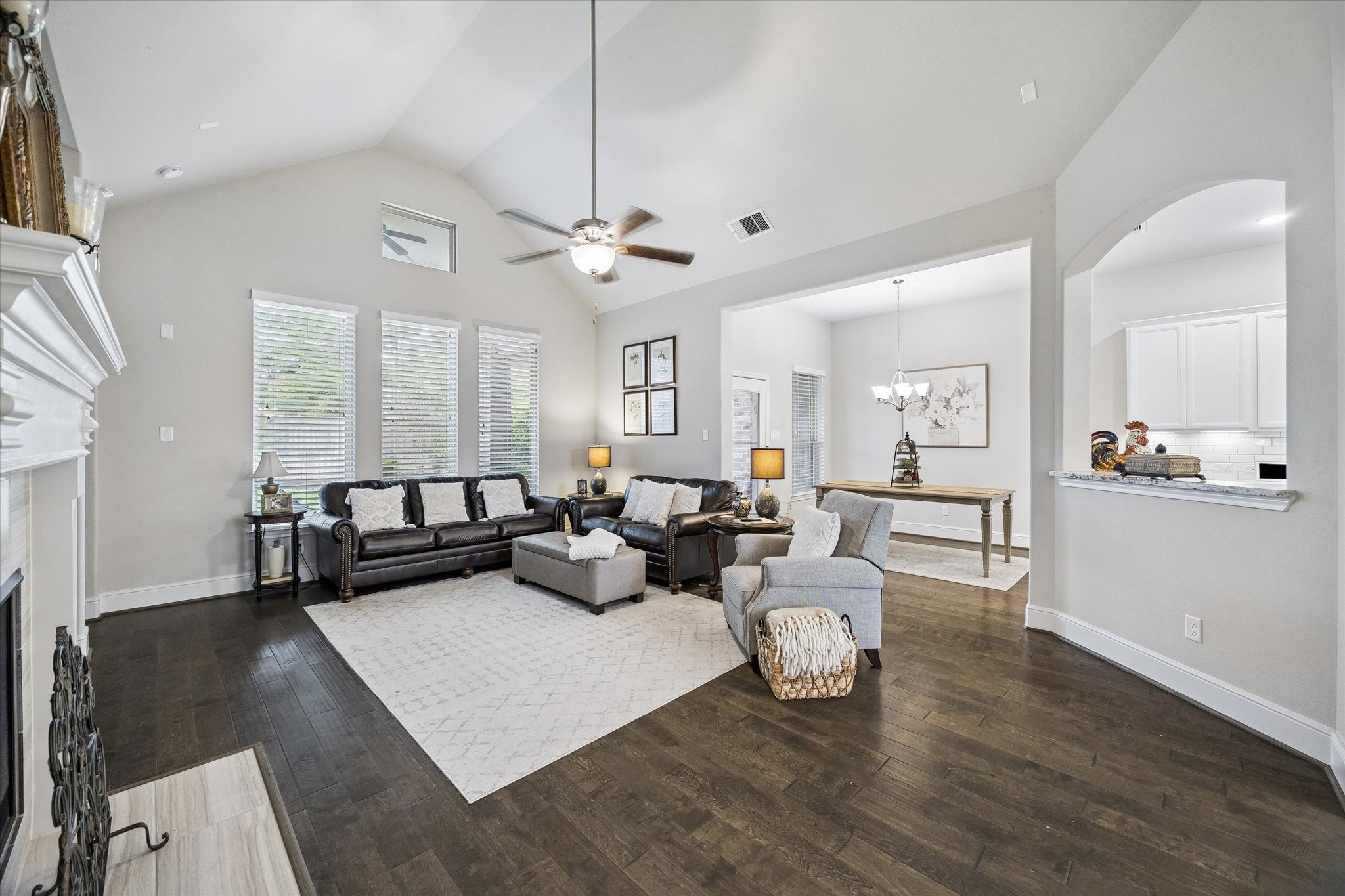 19 Peace Tree Way Tomball, TX 77375 - Photo 13 of 36 Spacious den featuring vaulted ceilings and a scenic view of the backyard.