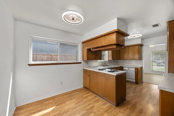 a kitchen with stainless steel appliances granite countertop a stove and a refrigerator