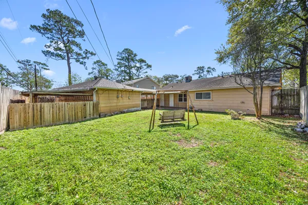 a house with a wooden fence