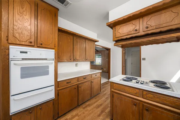 a kitchen with stainless steel appliances granite countertop a stove and a refrigerator