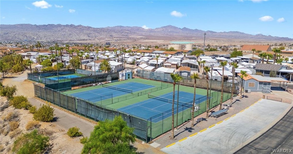 2000 Ramar Road, Unit 249 Bullhead City, AZ 86442 - Photo 29 of 40 Dedicated pickleball courts with fencing and seating areas.