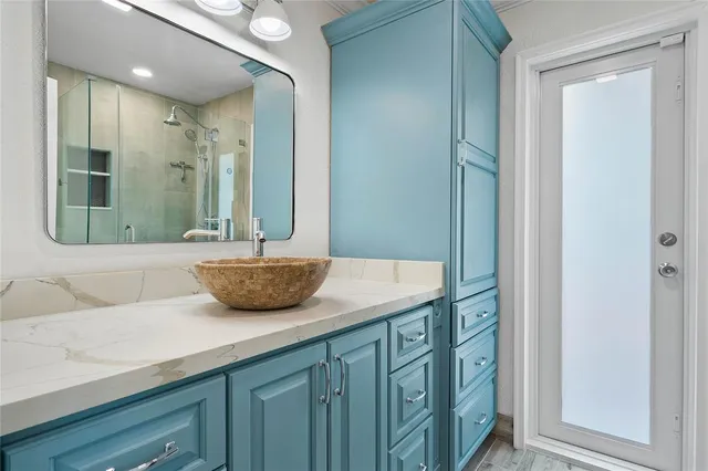 a kitchen with stainless steel appliances a stove a sink and a refrigerator