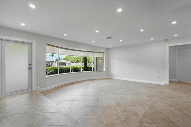 a view of an empty room with a window